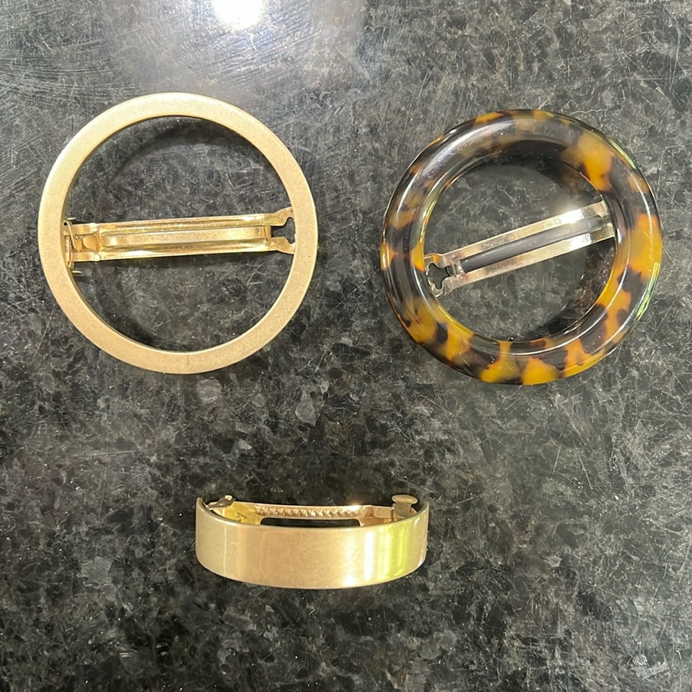 Two brass Madewell clips, one Machette tortious clip